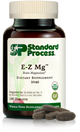 Image of E-Z Mg bottle next to tablets of magnesium supplements.