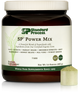 Tub of SP Power Mix next to a scoop of the green powder.